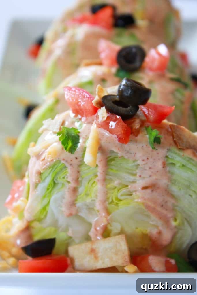 Vibrant Fiesta Wedge Salad 11 Sliced black olives as the final topping on a Fiesta Wedge Salad, providing a briny and savory element, or suggest creamy avocado.