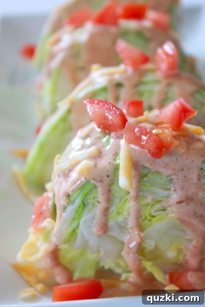 Vibrant Fiesta Wedge Salad 8 Freshly diced tomatoes scattered over a Fiesta Wedge Salad, enhancing its vibrant color and adding a juicy, refreshing texture.