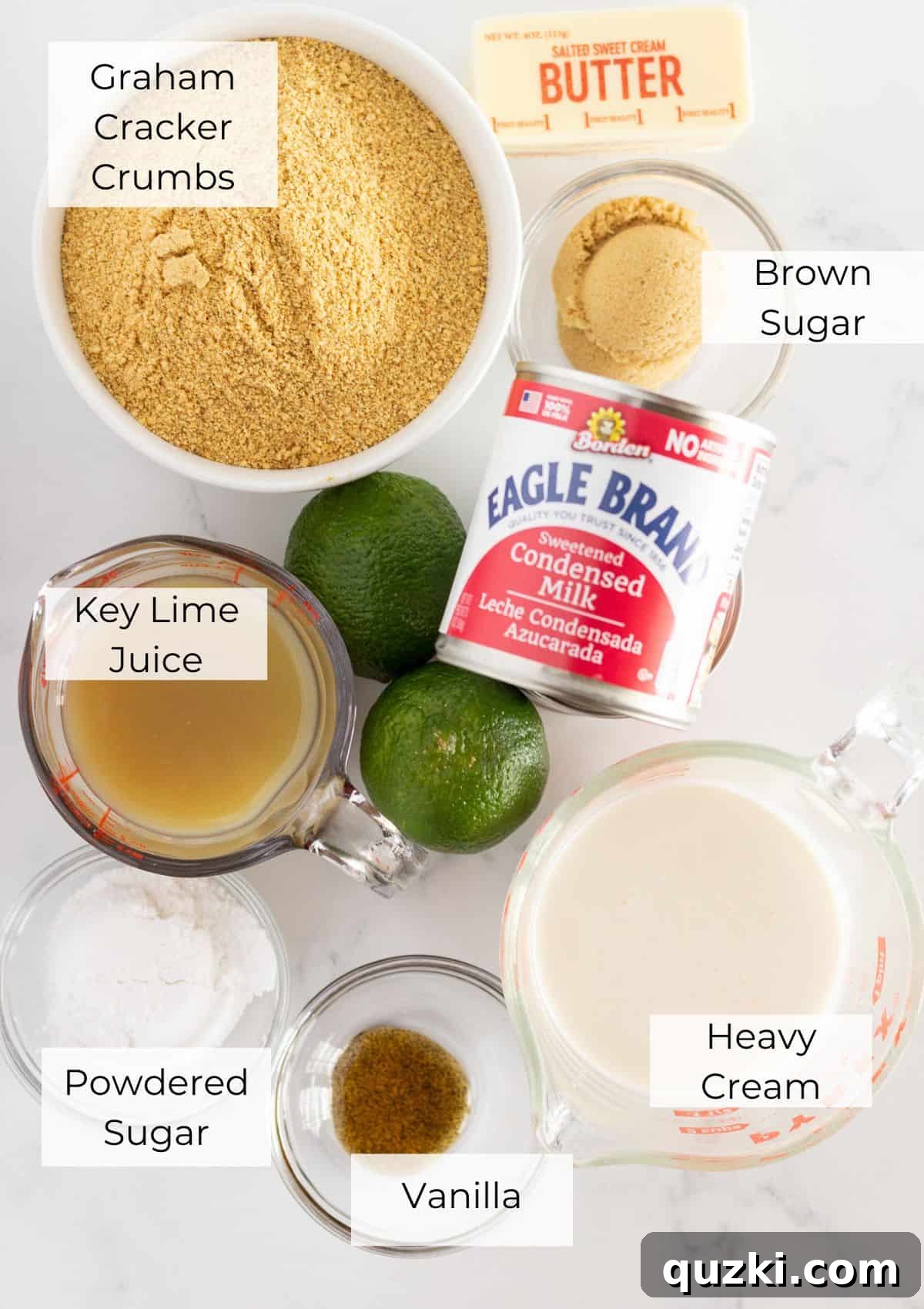 The ingredients needed to make a key lime pie with graham cracker crust and whipped cream, laid out on a table.