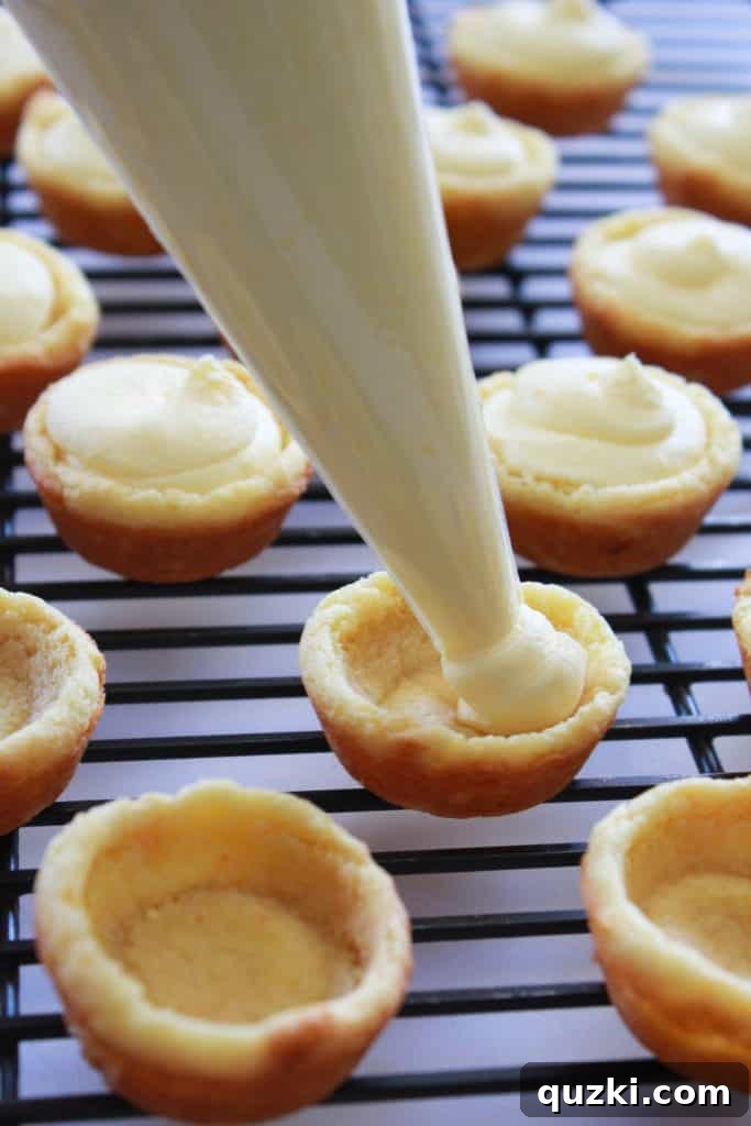 Effortless Boston Cream Pie Cookie Treats 12 Piping vanilla cream into cookie cups