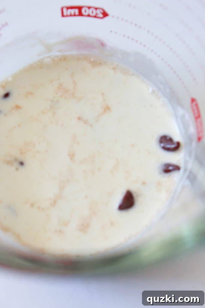 Effortless Boston Cream Pie Cookie Treats 13 Heavy cream and semi-sweet chocolate chips in a microwave-safe bowl