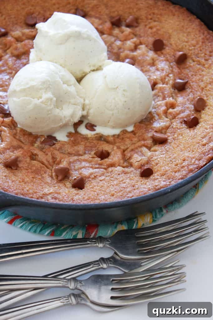 Decadent Skillet Chocolate Chip Cookie 2 Chocolate Chip Skillet Pizookie served family style, gooey and topped with melting vanilla ice cream