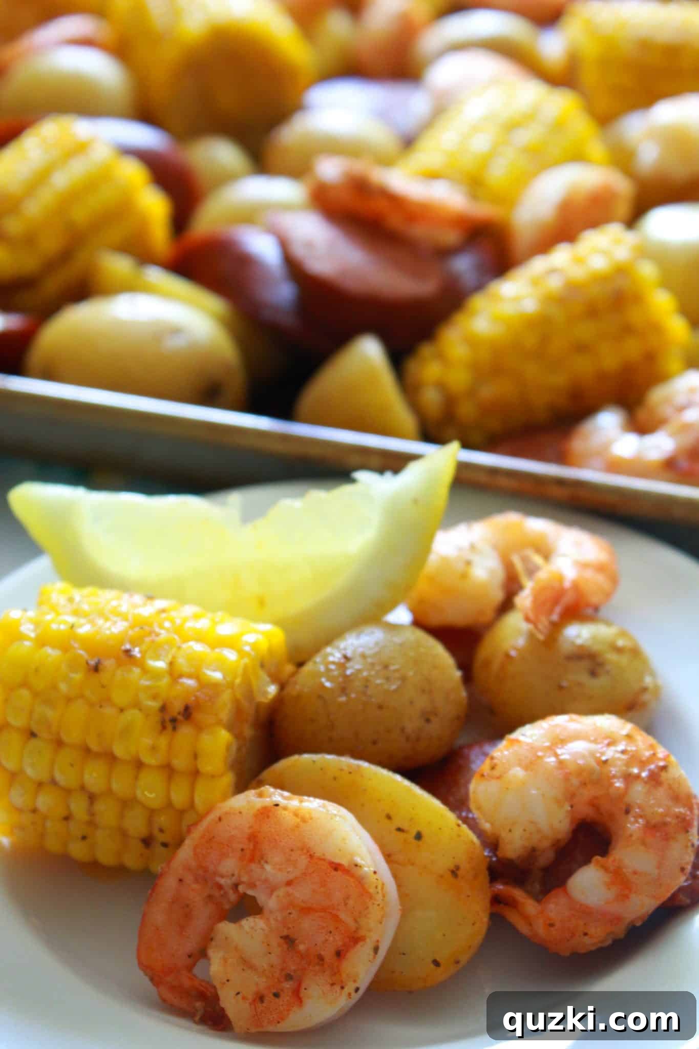 Ultimate Sheet Pan Shrimp Boil 2 A vibrant Sheet Pan Cajun Shrimp Boil, freshly baked and ready to serve on a baking sheet, showcasing succulent shrimp, spicy sausage, sweet corn, and tender potatoes.