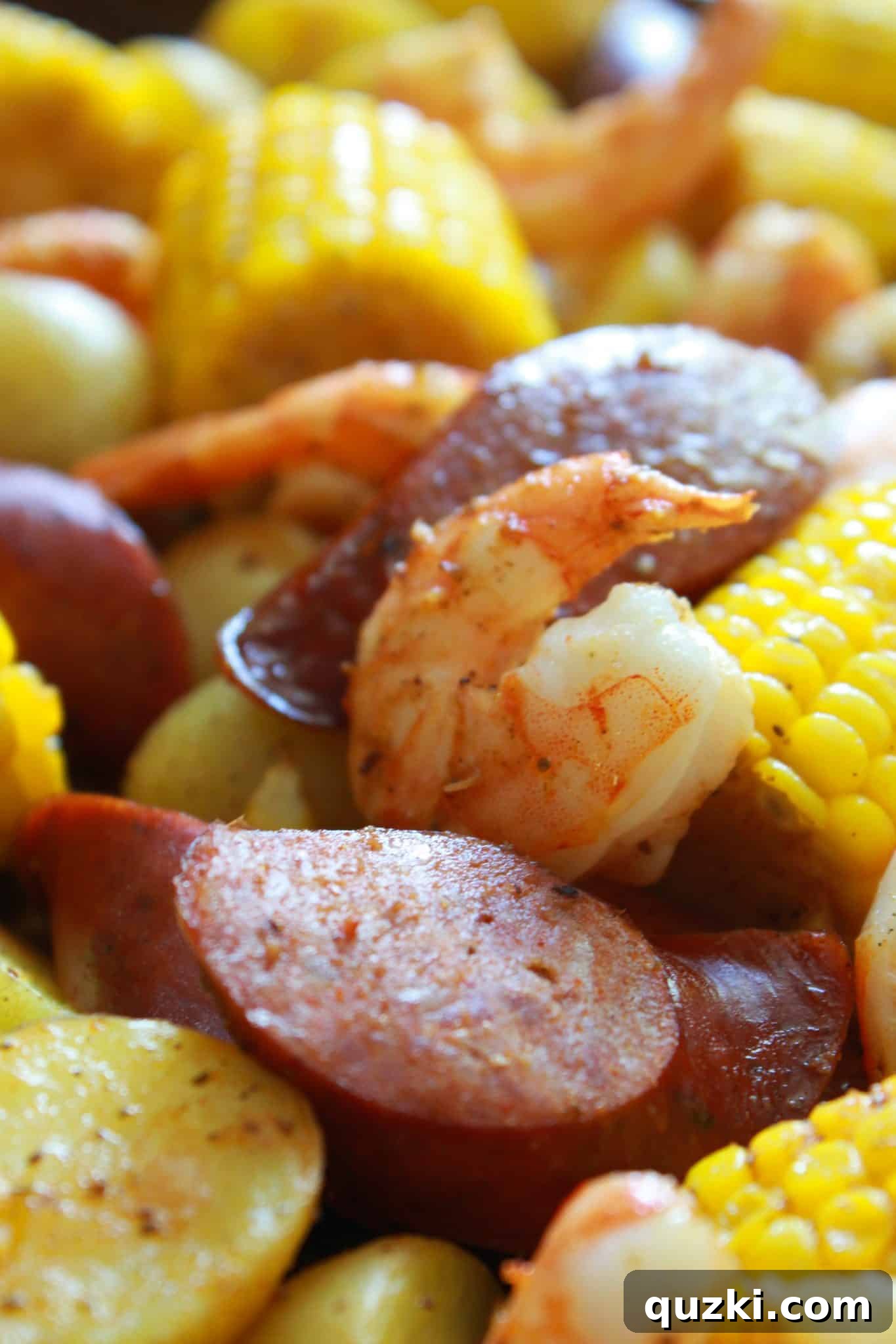 Ultimate Sheet Pan Shrimp Boil 11 An inviting close-up photo of the finished Sheet Pan Cajun Shrimp Boil, highlighting the perfectly cooked shrimp, tender vegetables, and savory sausage.