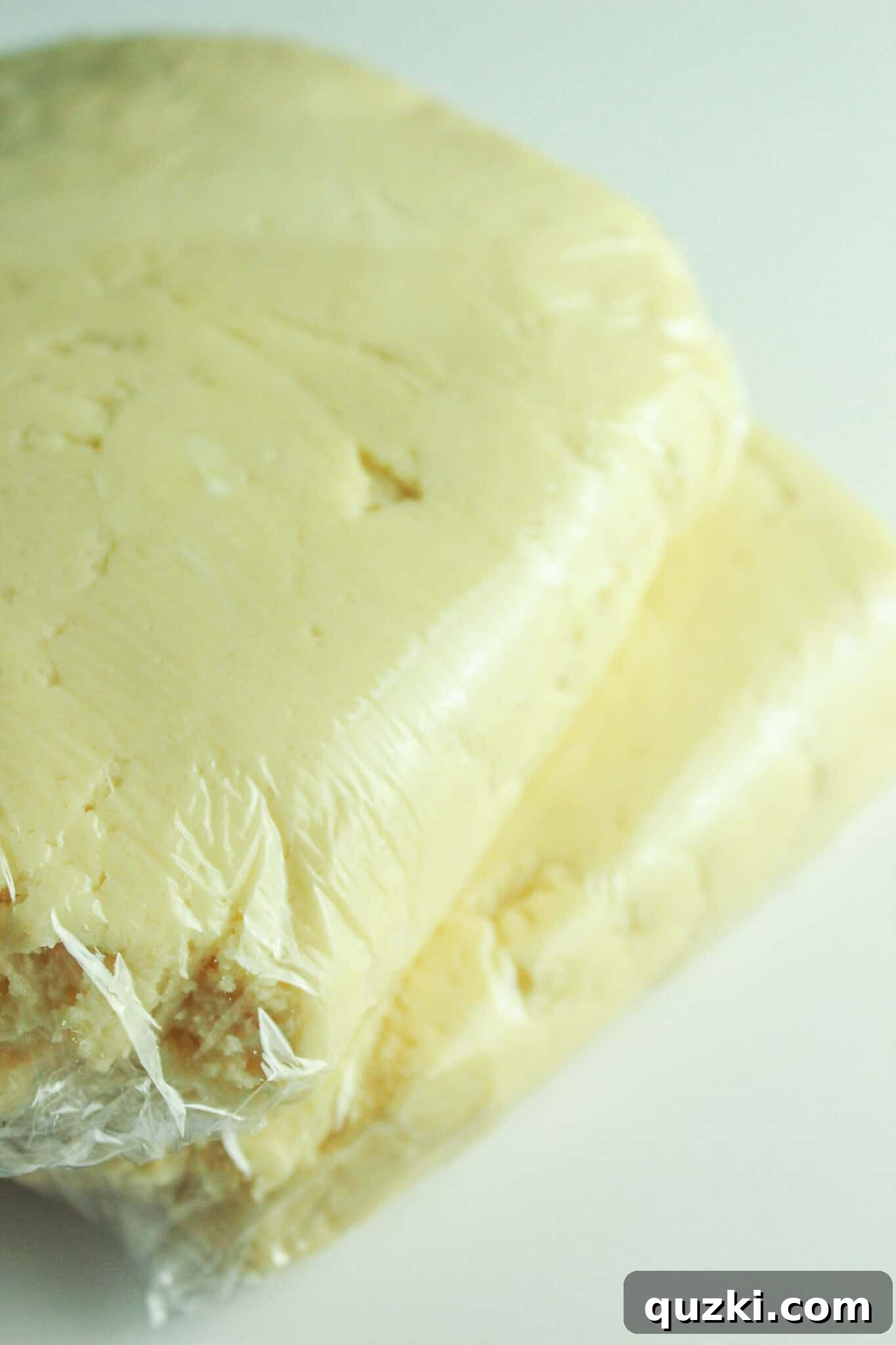 Effortless Cream Cheese Sugar Cookies 5 Making the sugar cookie dough and wrapping it in plastic wrap to chill.