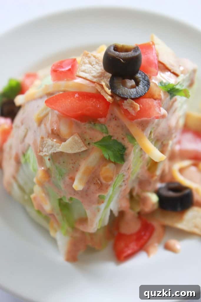 Fiesta Wedge Salad with zesty dressing and toppings