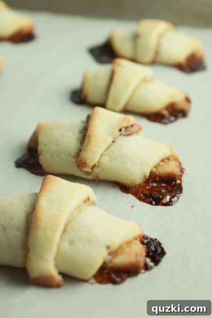 A rolled-out and filled dough disc expertly cut into 12 triangular wedges, resembling a pie or pizza.