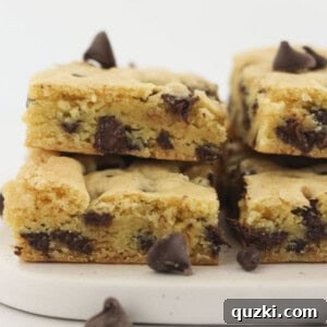 Stacks of delicious chocolate chip cookie bars made with a yellow cake mix, ready to be devoured.