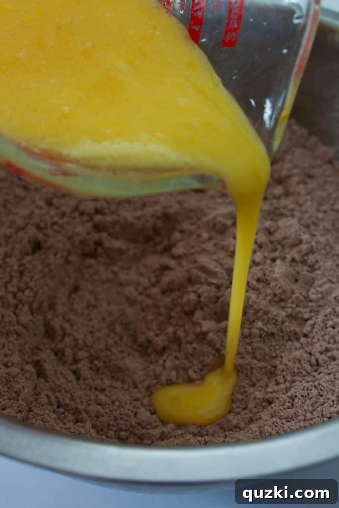 Effortless Indulgence: Crafting Amazing Cookies from Cake Mix 4 Whisking eggs for delicious cake mix cookies