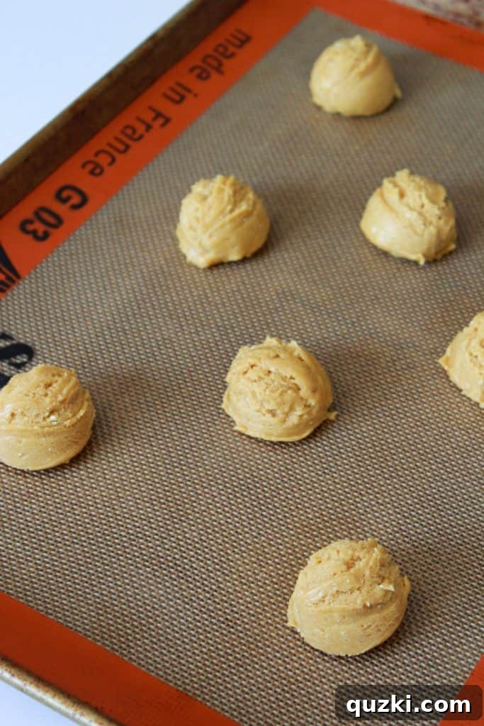 Effortless Indulgence: Crafting Amazing Cookies from Cake Mix 6 Using a cookie scoop for uniform cake mix cookies
