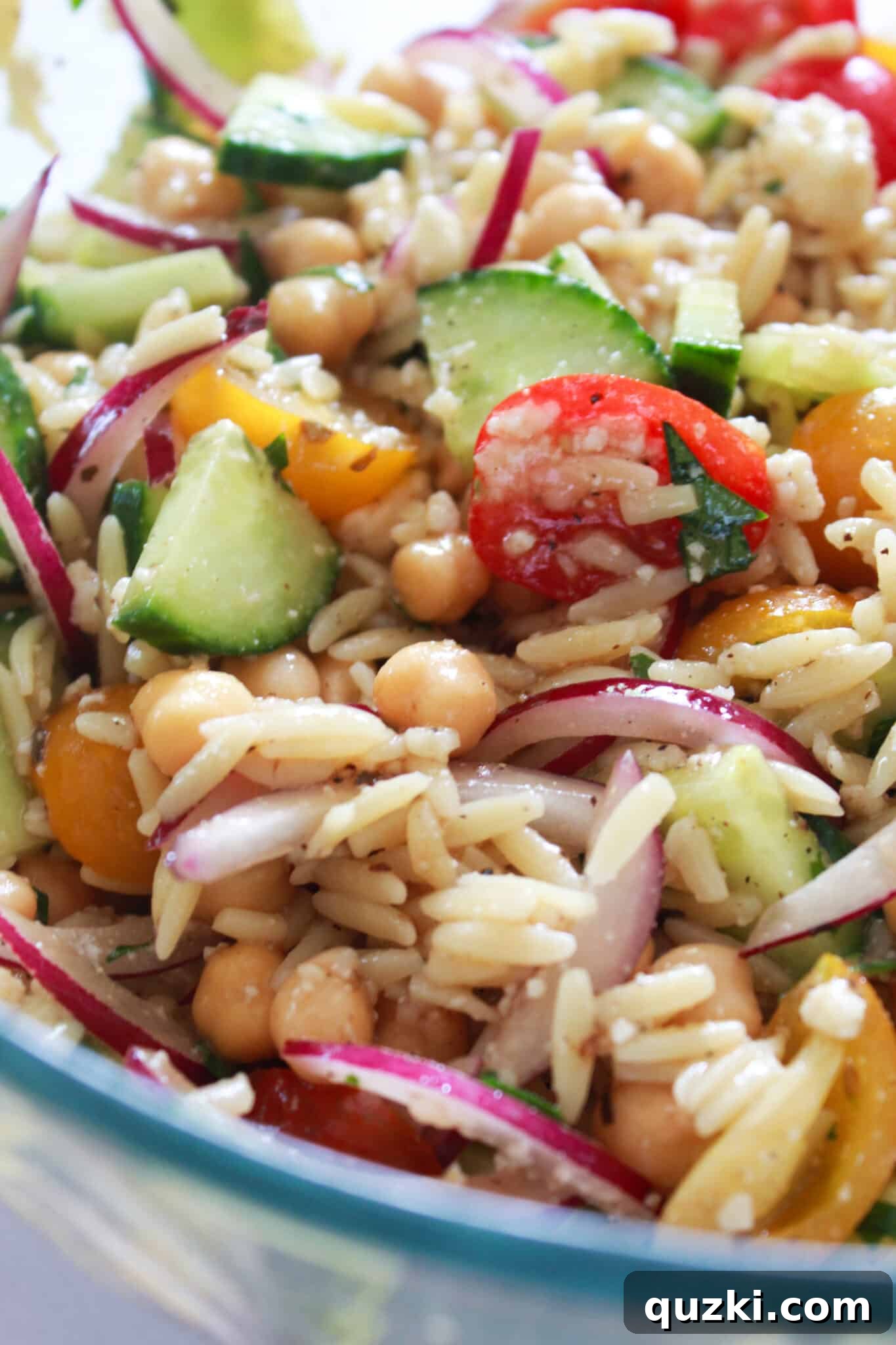 Mediterranean Orzo Salad with Chickpeas in a bowl, ready to serve.
