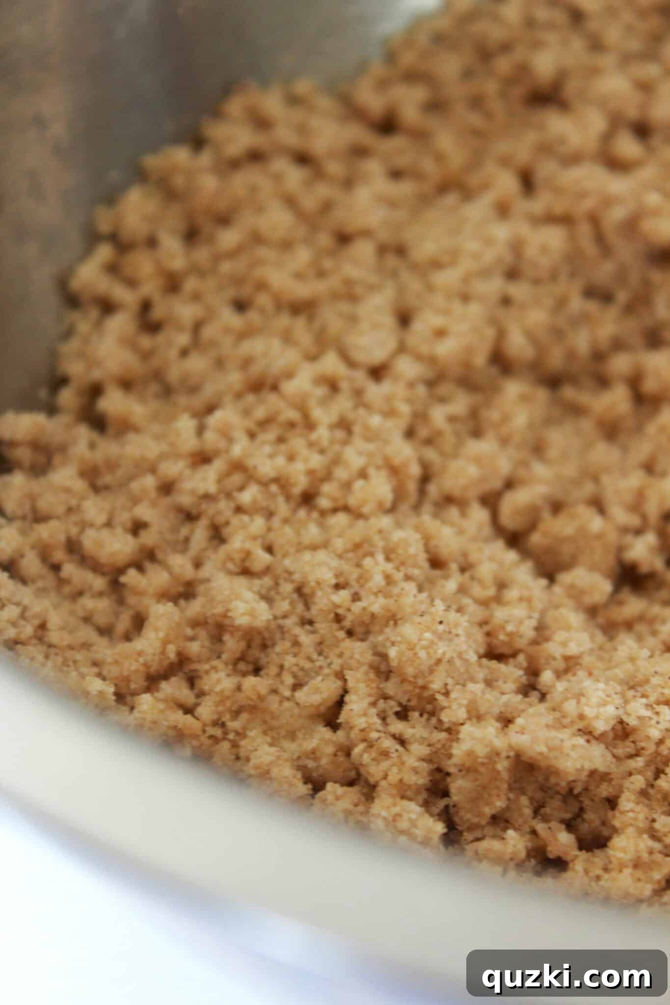 Effortless Zucchini Crumb Cake 9 Spreading the zucchini cake batter into a prepared pan and mixing the ingredients for the crumb topping.