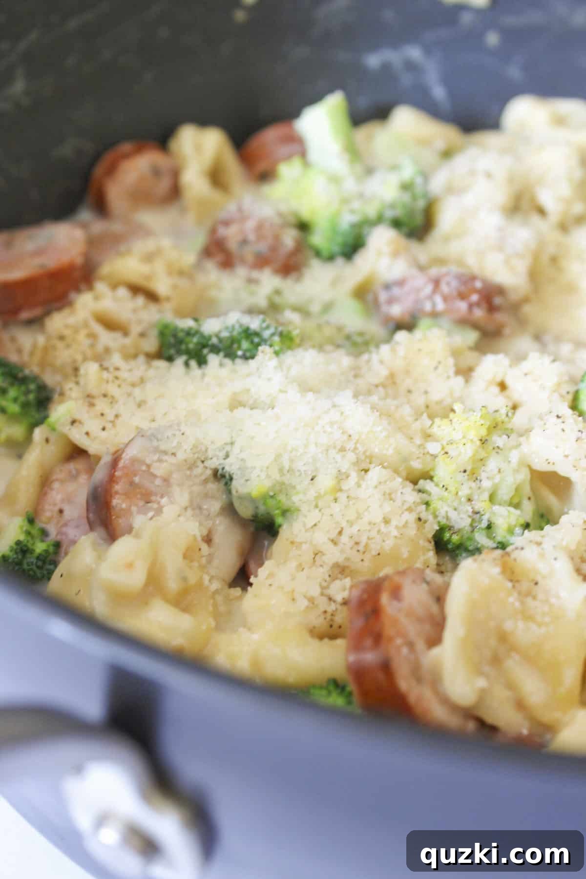 Single Skillet Sausage Tortellini Supper 6 The finished creamy sausage tortellini skillet, garnished with fresh basil, served hot directly in the pan it was cooked in.