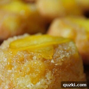 Effortless Peach Flip Cupcakes 12 Close-up of a single Easy Peach Upside Down Cupcake with its caramelized peach topping.