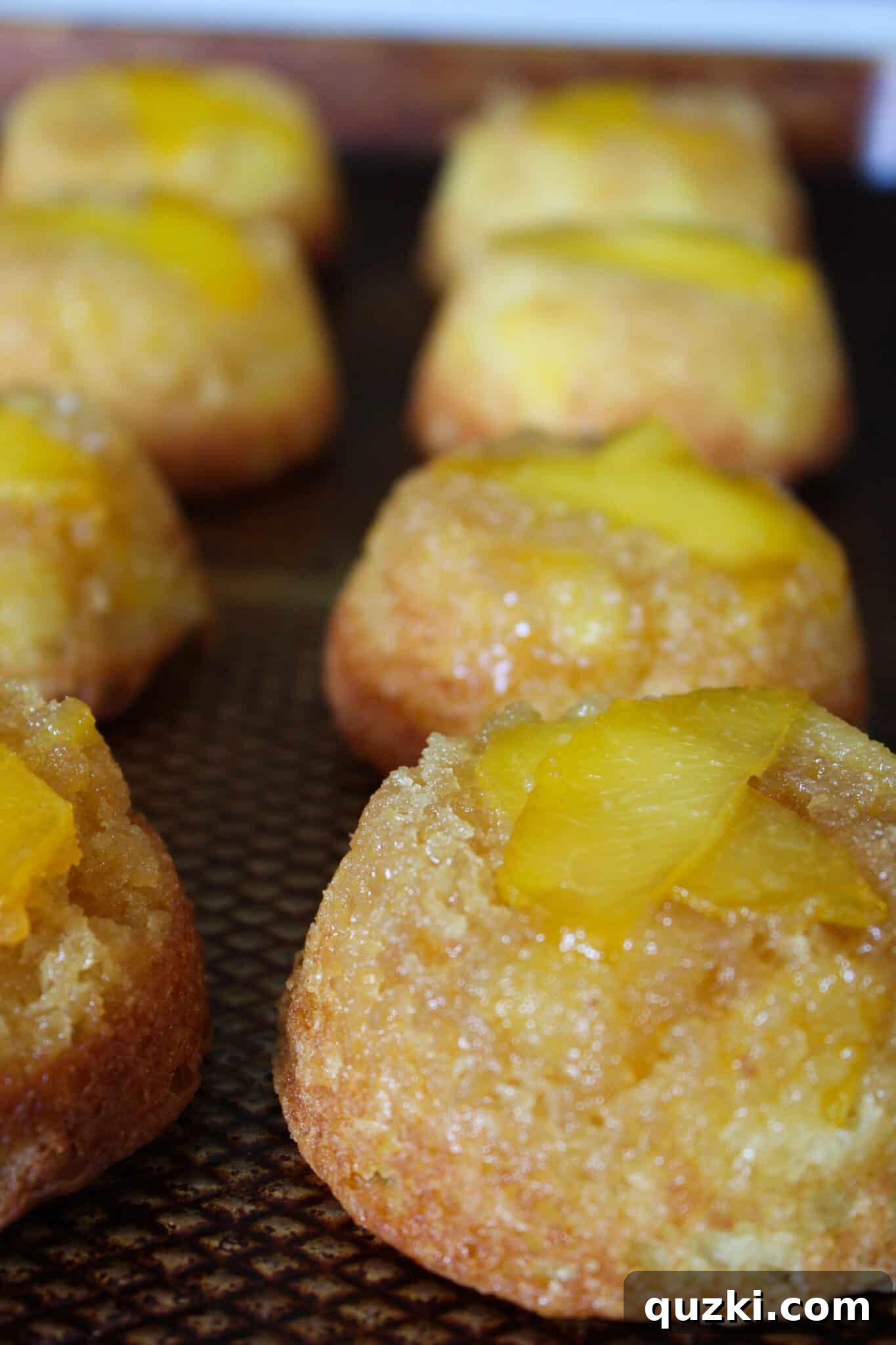 Effortless Peach Flip Cupcakes 10 Inverted Easy Peach Upside Down Cupcakes cooling on a wire rack, showing their perfect caramelized peach topping.