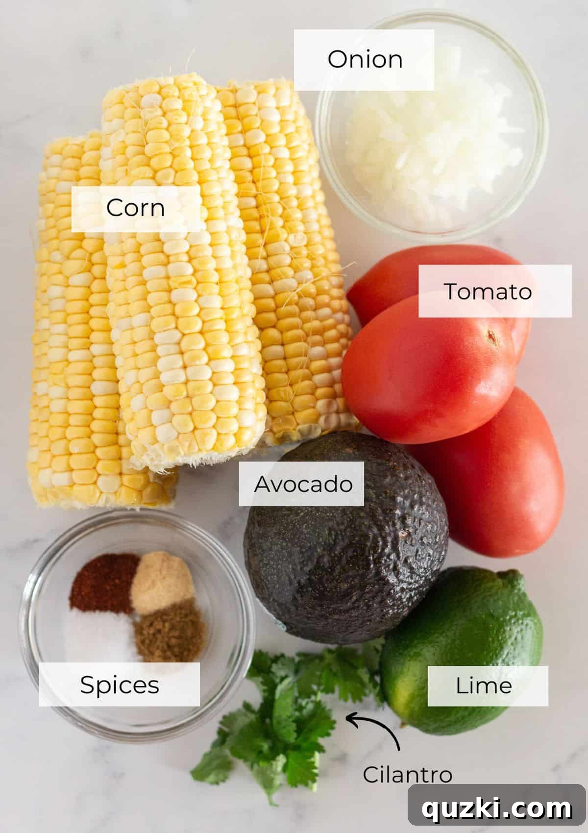 Vibrant Corn and Avocado Salsa 3 A selection of fresh, ripe ingredients laid out for making corn and avocado salsa, including corn, avocados, tomatoes, onion, and limes.