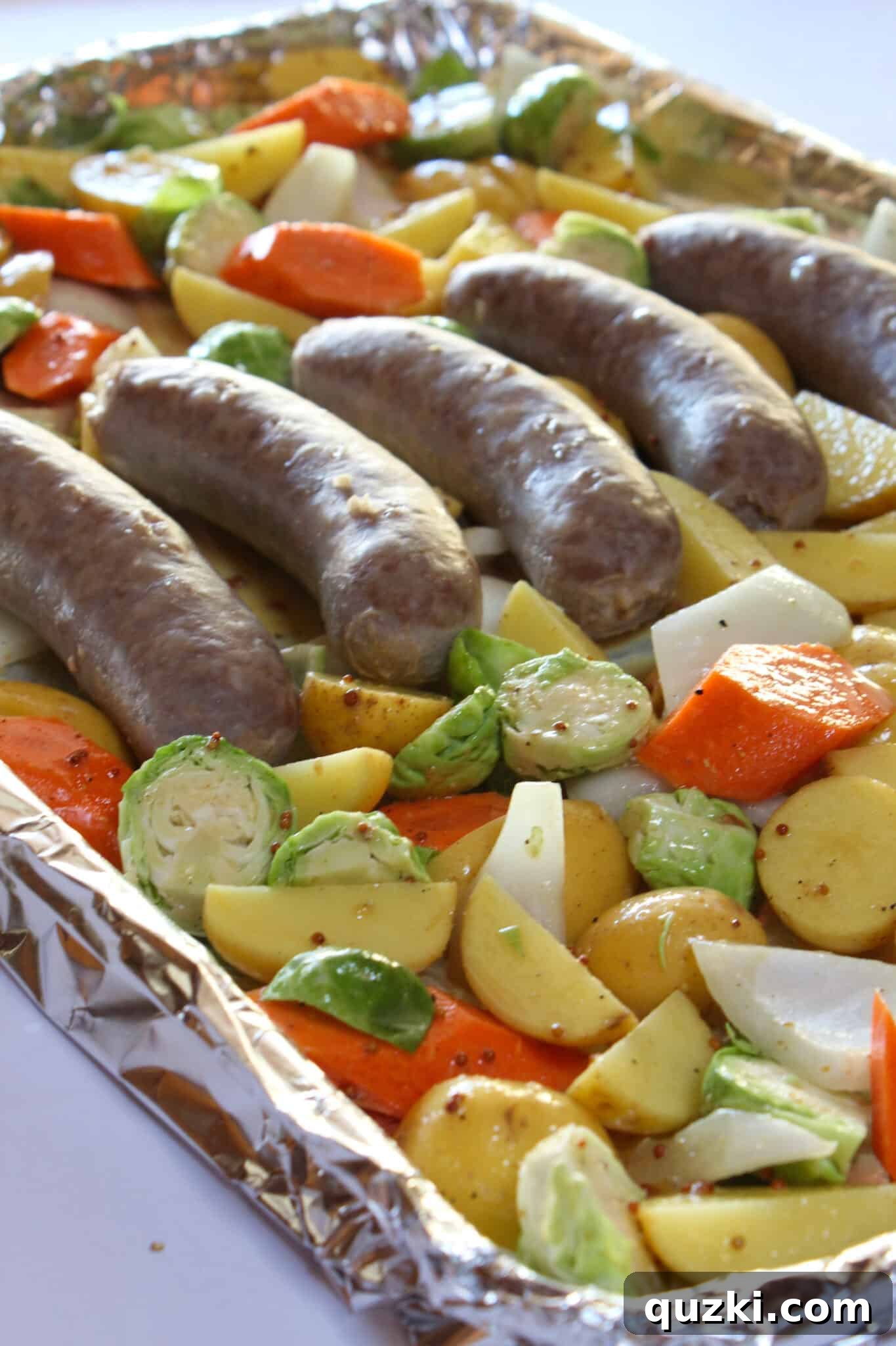 Tek Tepsi Sosisli Patates Lezzeti 13 Baking the brats and potatoes along with other vegetables on a single sheet pan until golden and roasted.
