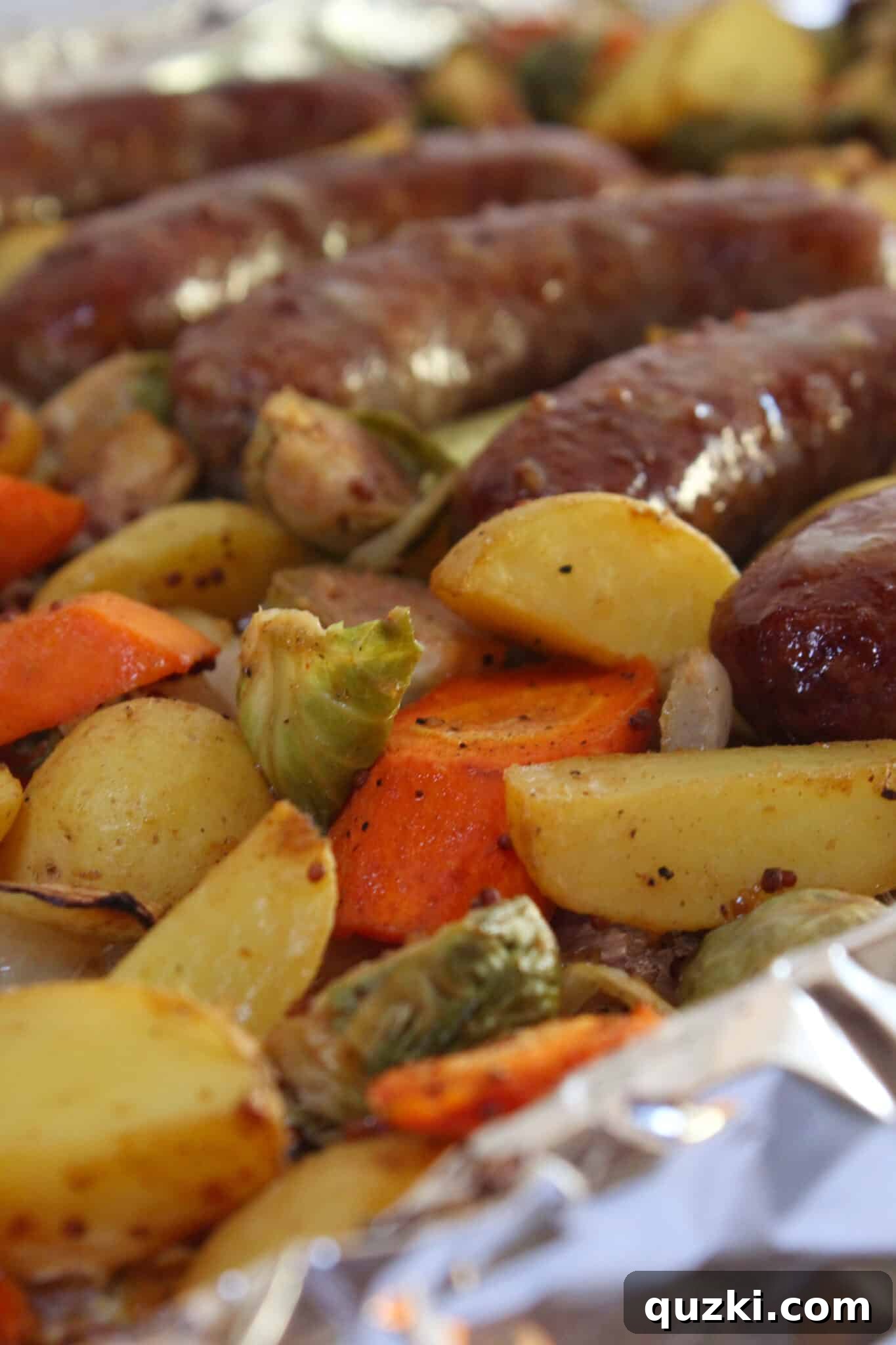 Tek Tepsi Sosisli Patates Lezzeti 14 Sheet Pan Brats and Potatoes on the sheet pan, perfectly roasted and ready to serve.