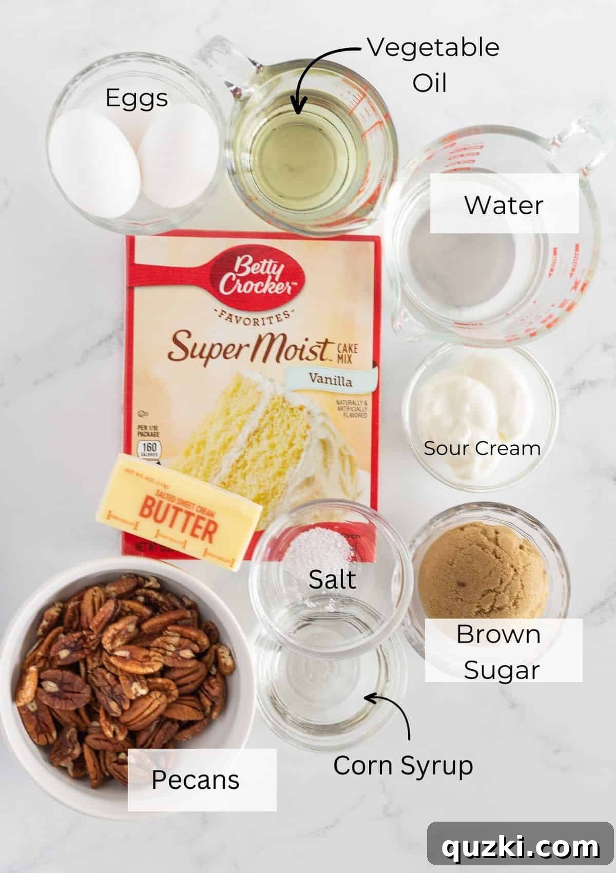 A flat lay photo showcasing all the fresh ingredients required to bake a homemade Pecan Upside Down Bundt Cake.