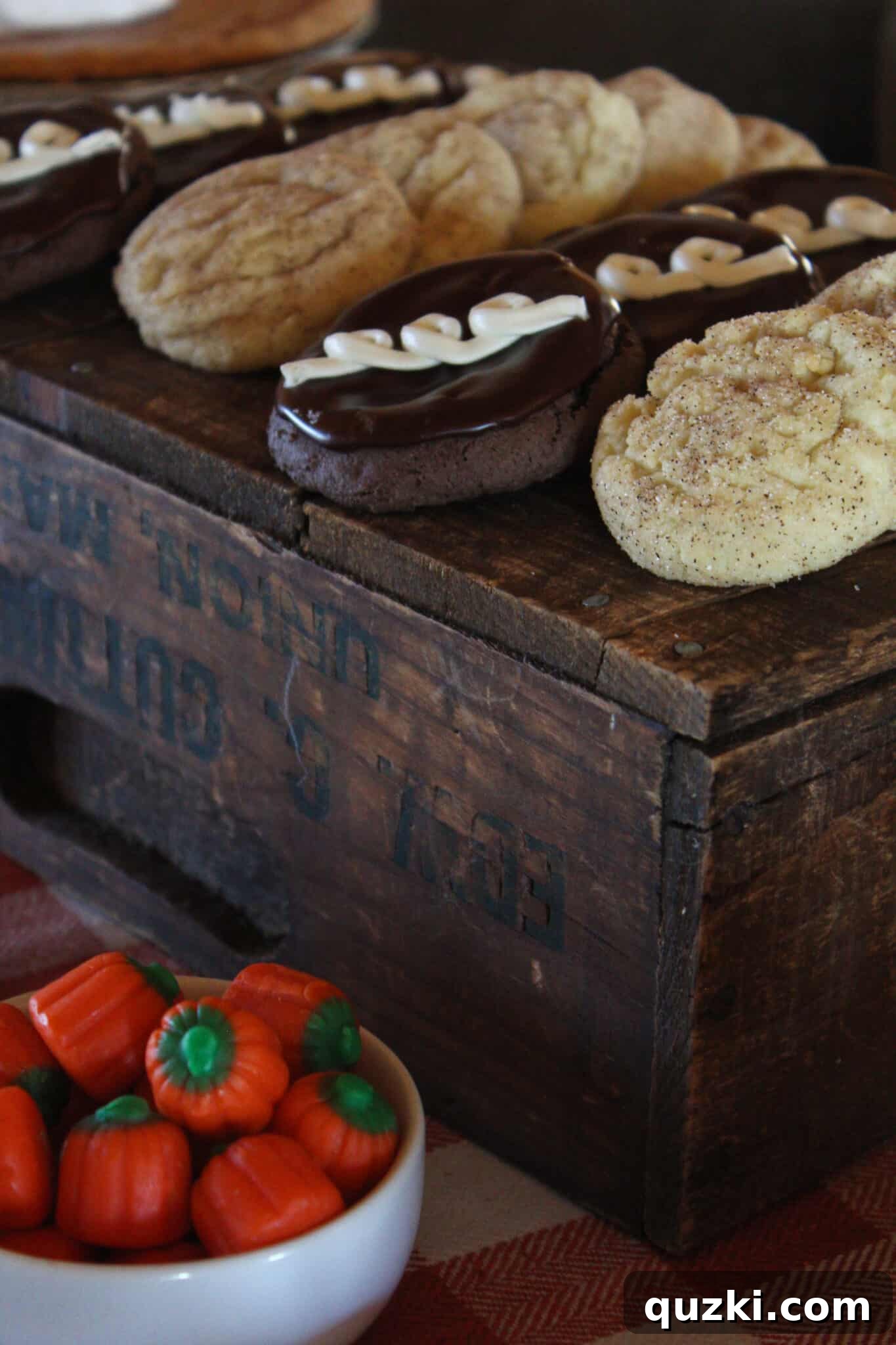 Mini cookies and festive candies arranged on a wooden crate for a rustic look.