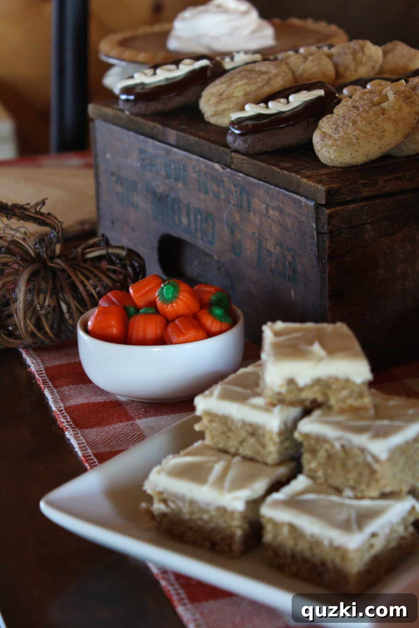 Delicious Banana Blondies stacked on a white plate with seasonal decor.