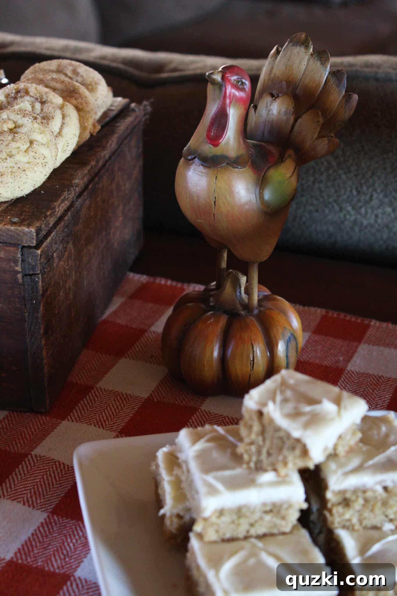 A charming turkey figurine guarding the Thanksgiving dessert table treats.