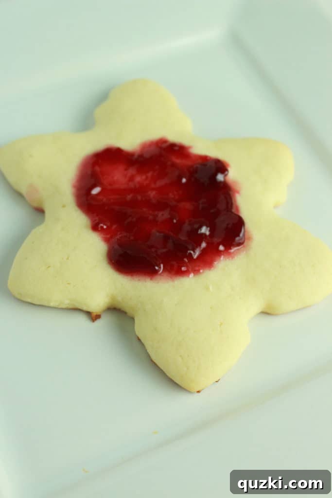 Cream Cheese Linzer Snowflakes 4 Rolling out soft cream cheese sugar cookie dough to an even thickness for cutting Linzer cookies.