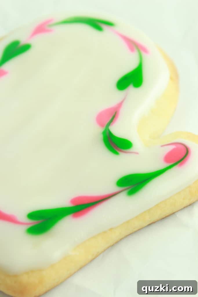 Close-up of an intricately decorated sugar cookie.