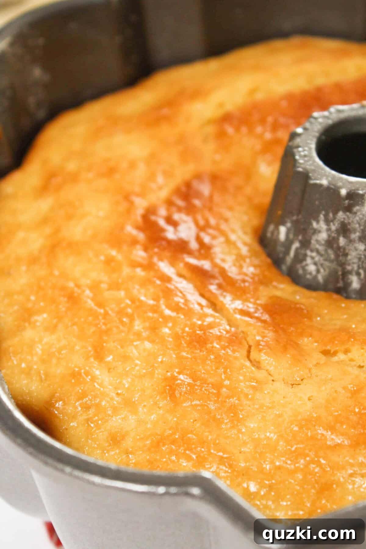 Baking the cake until it is golden brown.