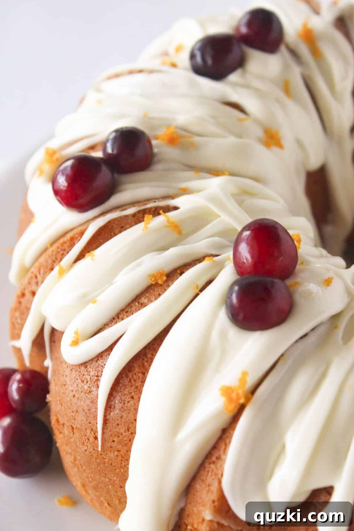 Getting ready to slice the cranberry orange cake made in a bundt pan.