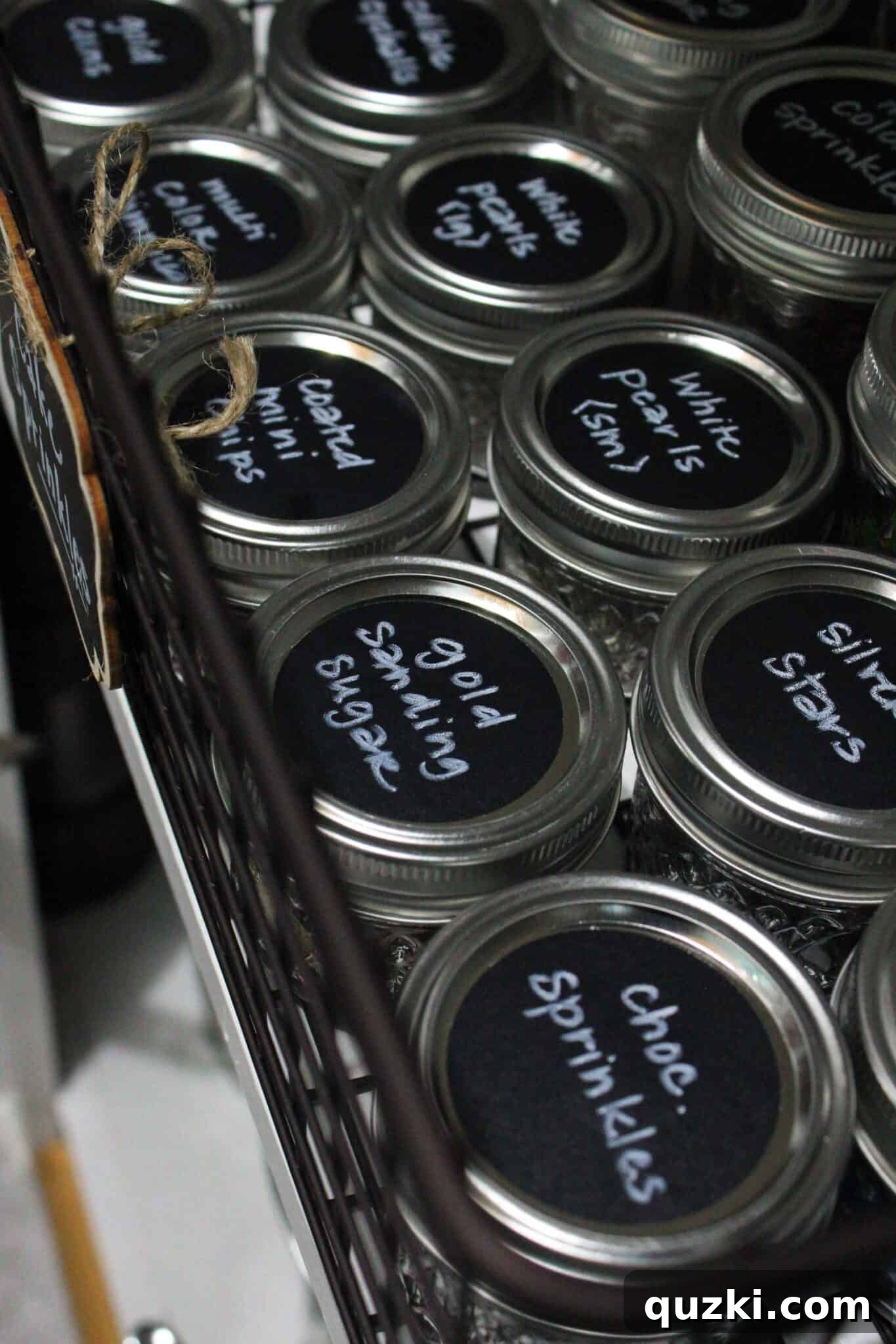 Pantry Organization Game-Changers 13 Variety of labeled pantry storage containers with chalkboard signs and stickers, demonstrating effective organization.