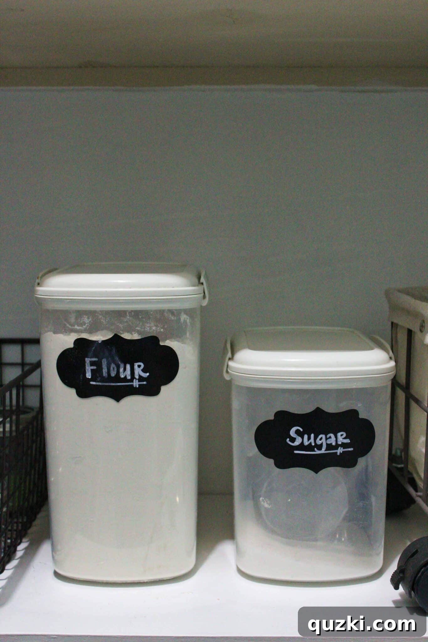Pantry Organization Game-Changers 15 Large food storage containers for flour and sugar, showing integrated scoops for easy access.