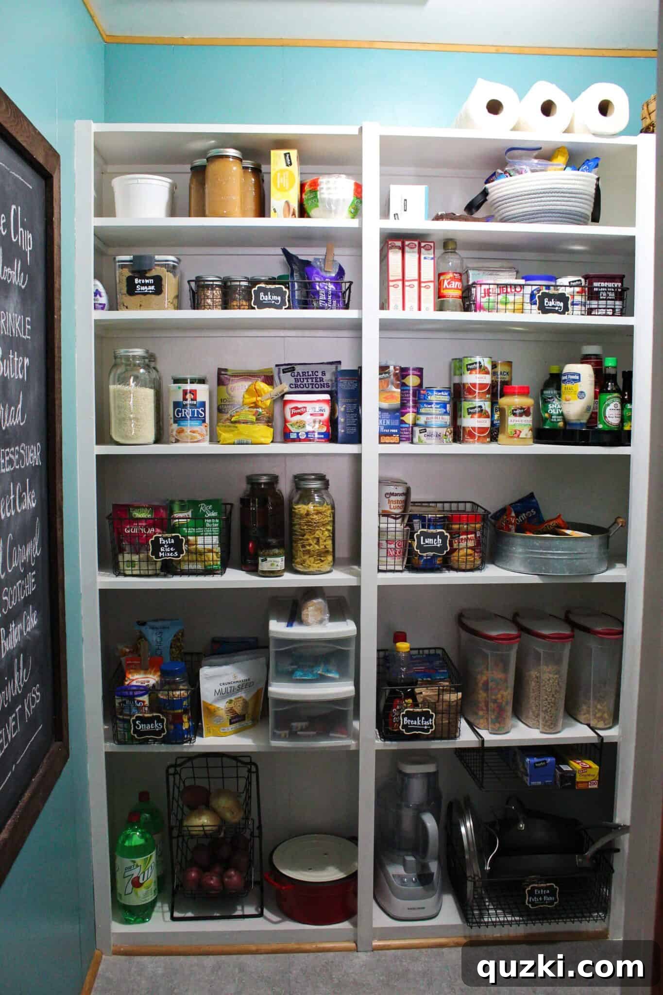 Pantry Organization Game-Changers 4 Wide view of a well-stocked and organized pantry showcasing different storage bins, baskets, and jars for essential items.