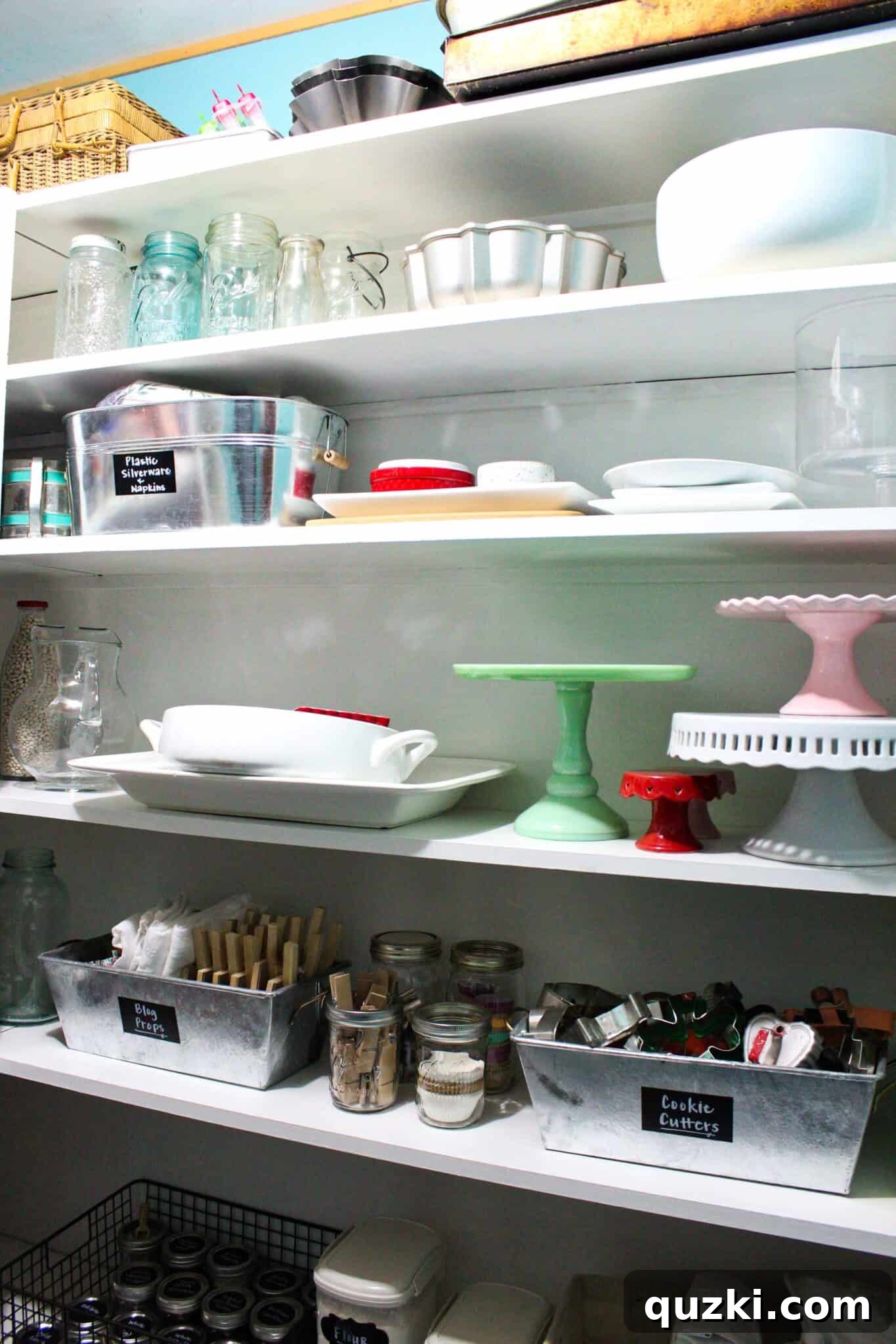 Pantry Organization Game-Changers 5 Close-up on pantry shelves displaying decorative cake plates and serving dishes, neatly stored as part of the organization strategy.