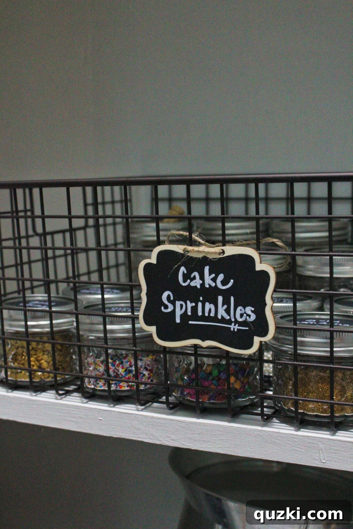 Pantry Organization Game-Changers 7 Various wire baskets filled with pantry items on a shelf, showcasing efficient and stylish storage solutions.