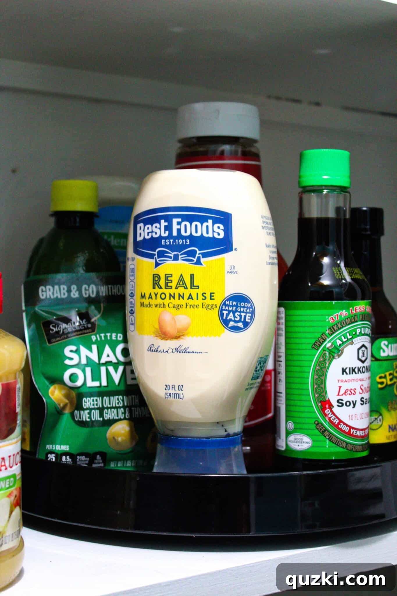 Pantry Organization Game-Changers 8 Lazy Susan turntable in a pantry organizing condiments, demonstrating accessible and tidy storage.