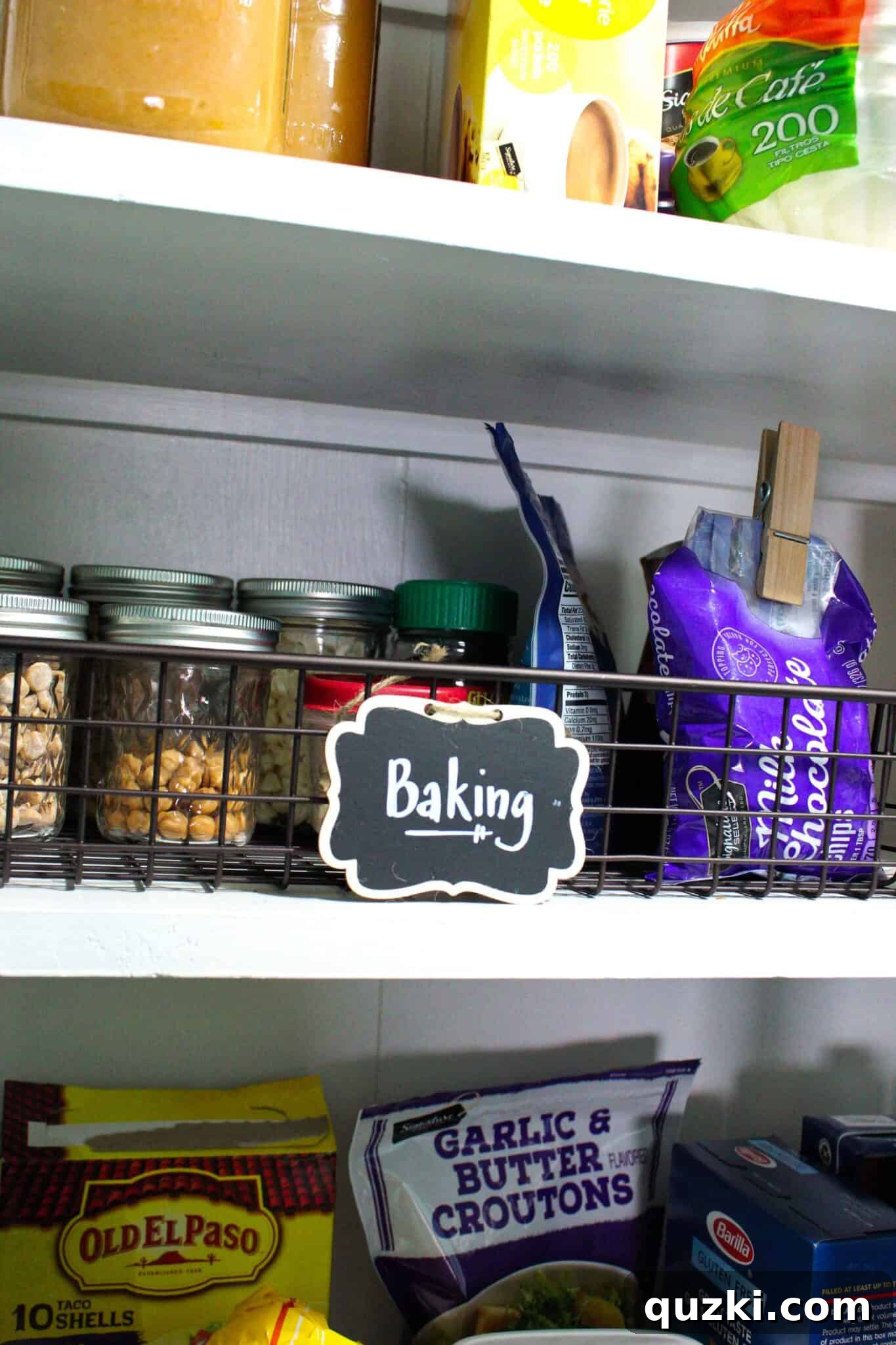 Pantry Organization Game-Changers 10 Smaller Mason jars organized on a pantry shelf, holding baking sprinkles and other small ingredients.