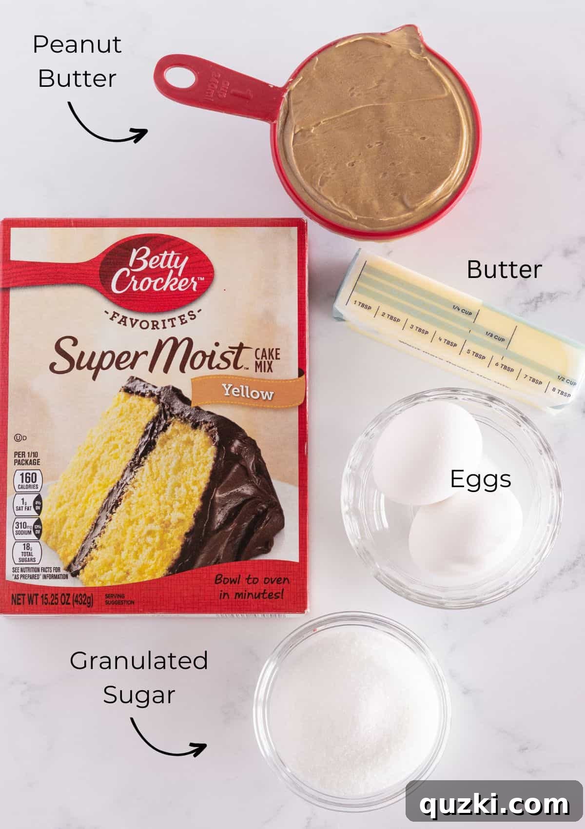 Peanut Butter Cake Mix Bliss 3 The four essential ingredients laid out: a box of yellow cake mix, a jar of peanut butter, a stick of butter, and two eggs.
