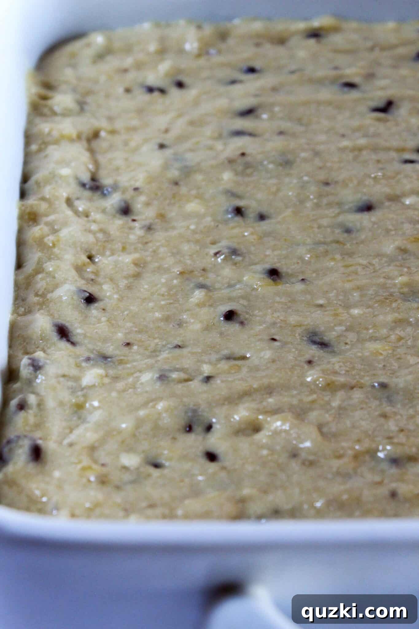 Decadent Banana Chocolate Chip Crumb Cake 8 Spreading Banana Chocolate Chip Crumb Cake batter into a 9x13 inch pan