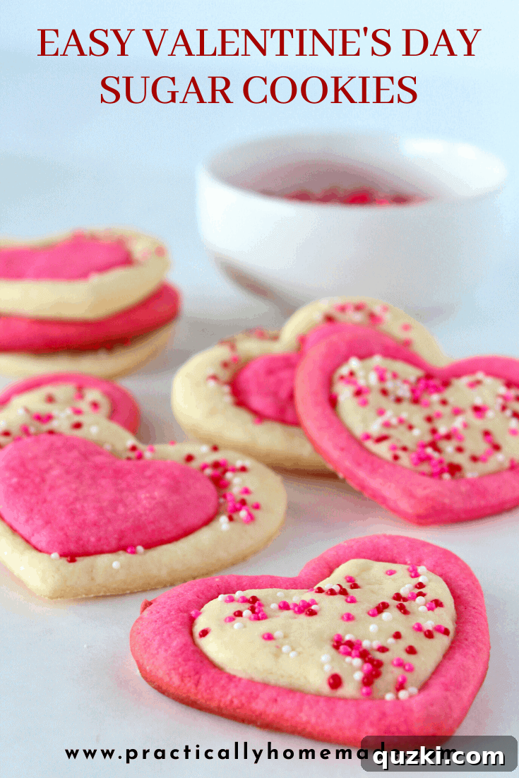 Close-up of freshly baked Easy Valentine's Day Sugar Cookies, showcasing the two-tone heart design