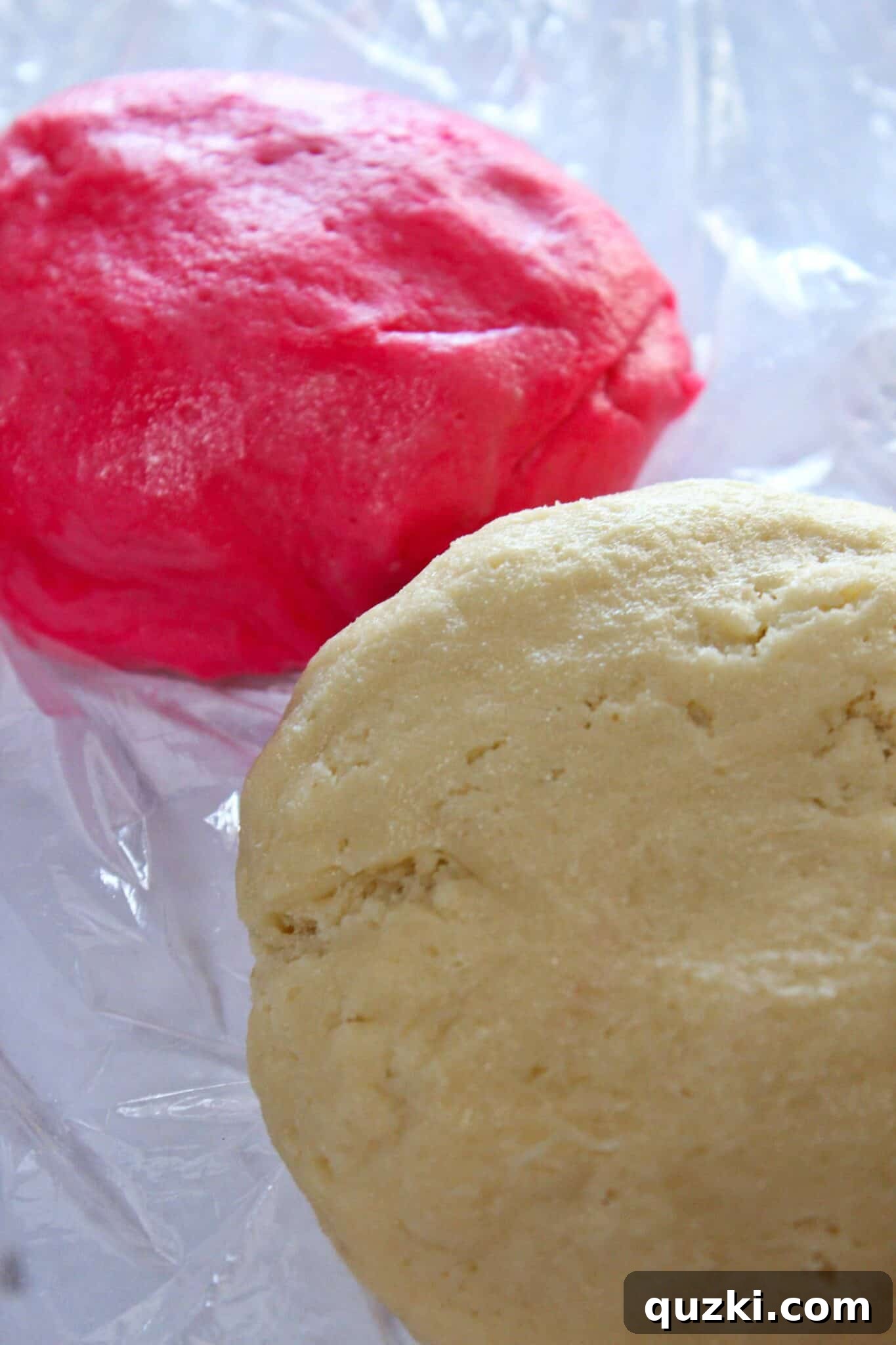 Two distinct dough colors, creamy white and soft pink, ready for shaping into Valentine's Day cookies