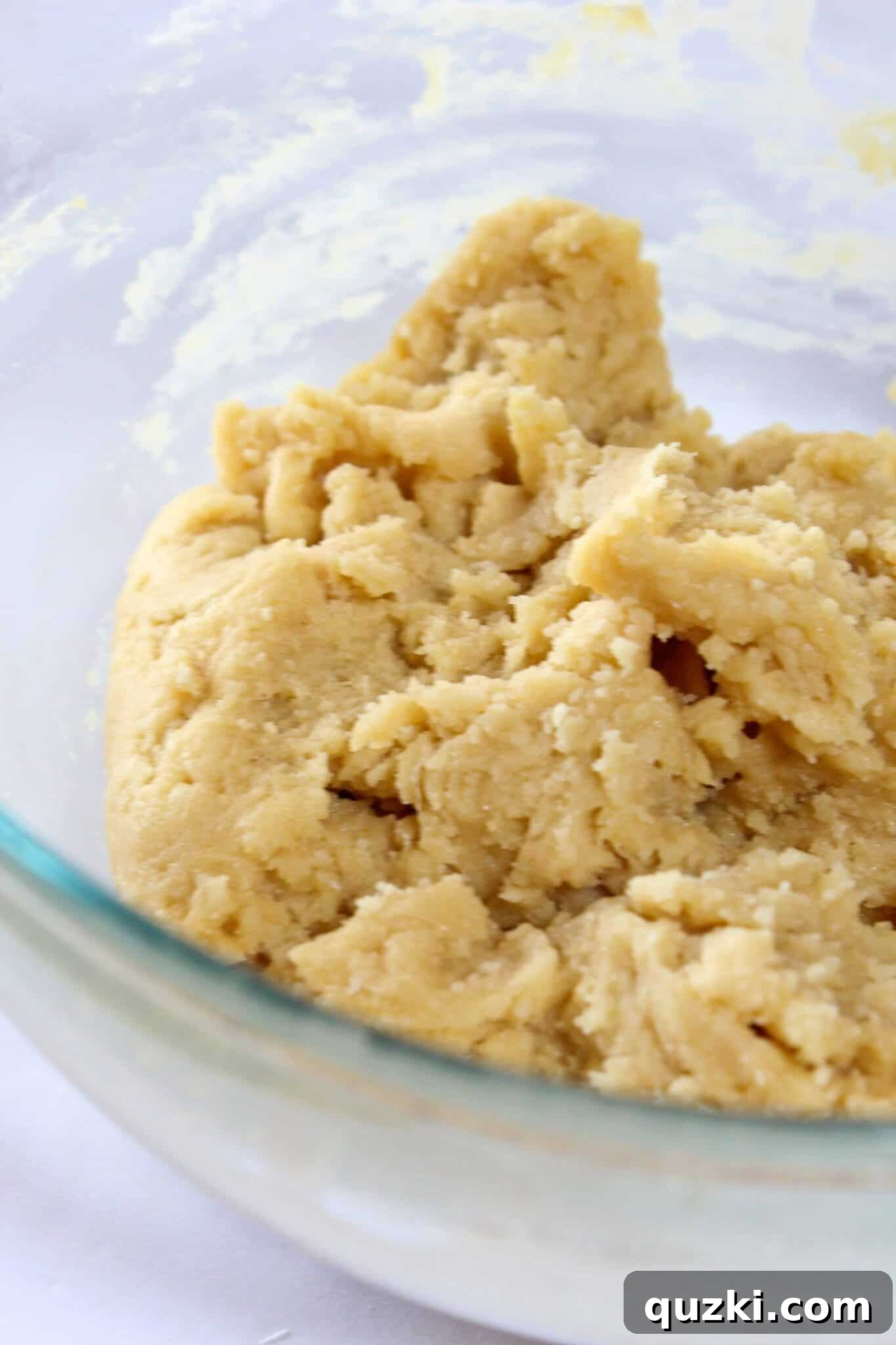 Melt-in-Your-Mouth Soft Chocolate Chip Delights 9 Thick and soft chocolate chip cookie dough in a mixing bowl.