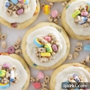 A dozen Lucky Charm Cookies with cereal milk frosting, neatly arranged.