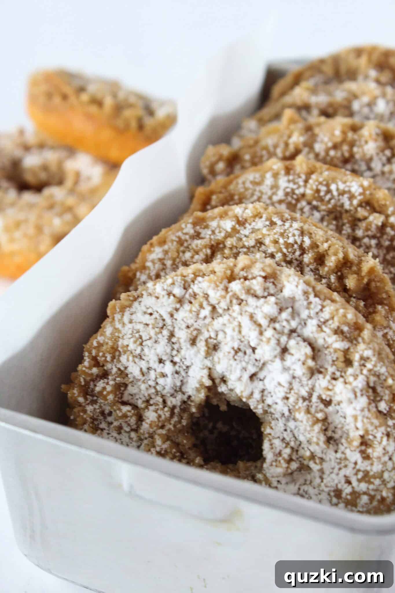 Easy Cinnamon Crumb Donut Recipe Made with a Pancake Mix featured by top US dessert blog, Practically Homemade