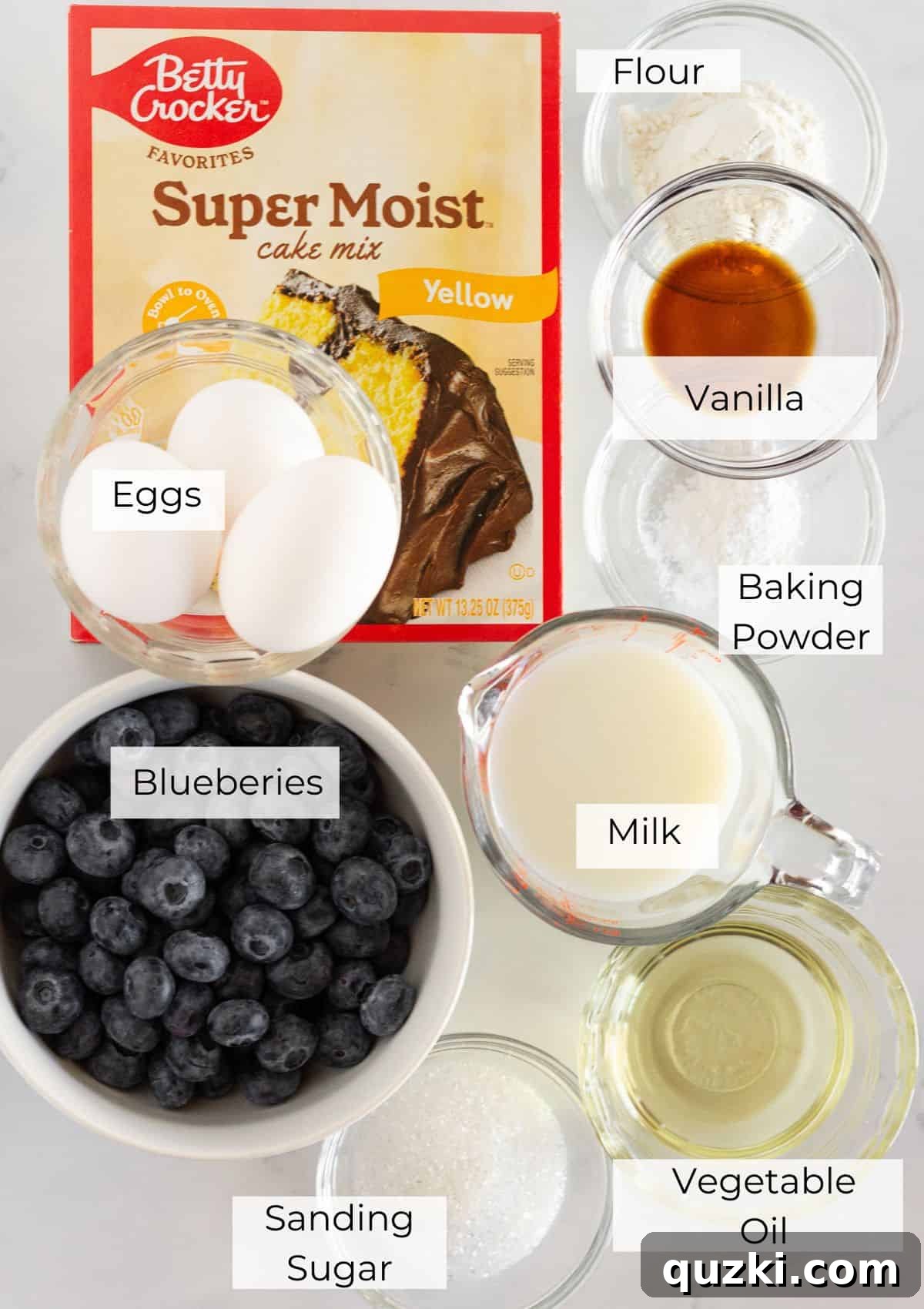 Effortless Blueberry Cake Mix Muffins 3 All the necessary ingredients laid out to make a batch of blueberry cake mix muffins.