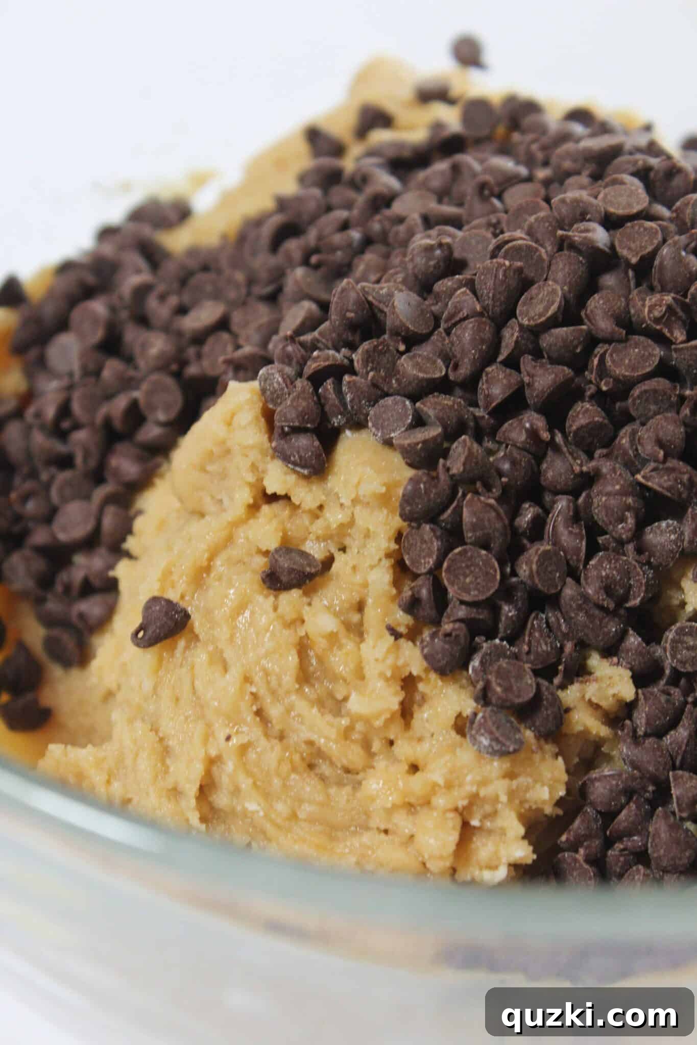 Salted Caramel Chocolate Chip Cookie Bars 7 Folding chocolate chips into the cookie dough mixture.