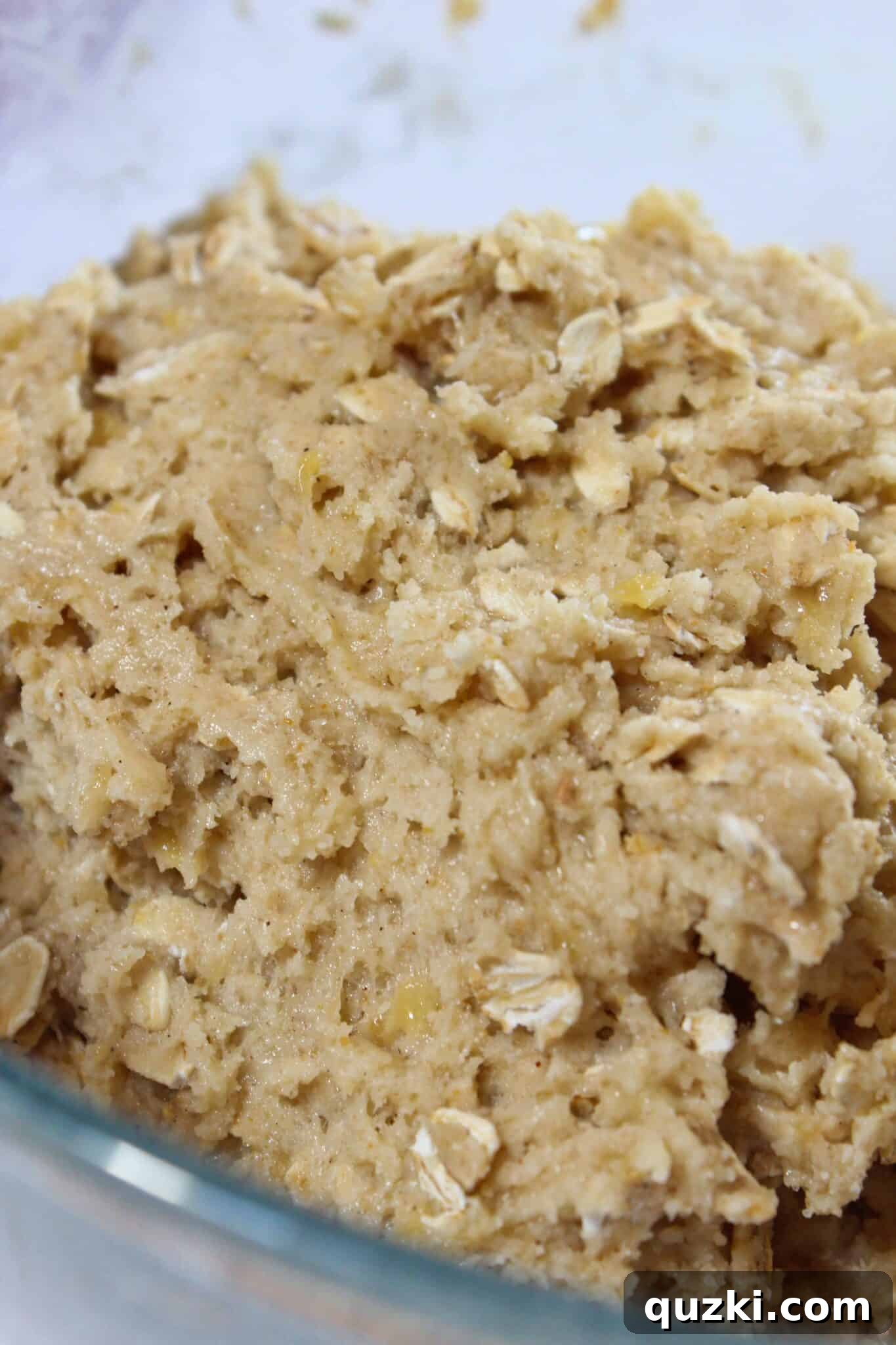 Nutty Brown Butter Banana Oatmeal Cookies 8 A close-up of the completed soft and pliable cookie dough for brown butter banana oatmeal cookies, showing bits of oatmeal and mashed banana.
