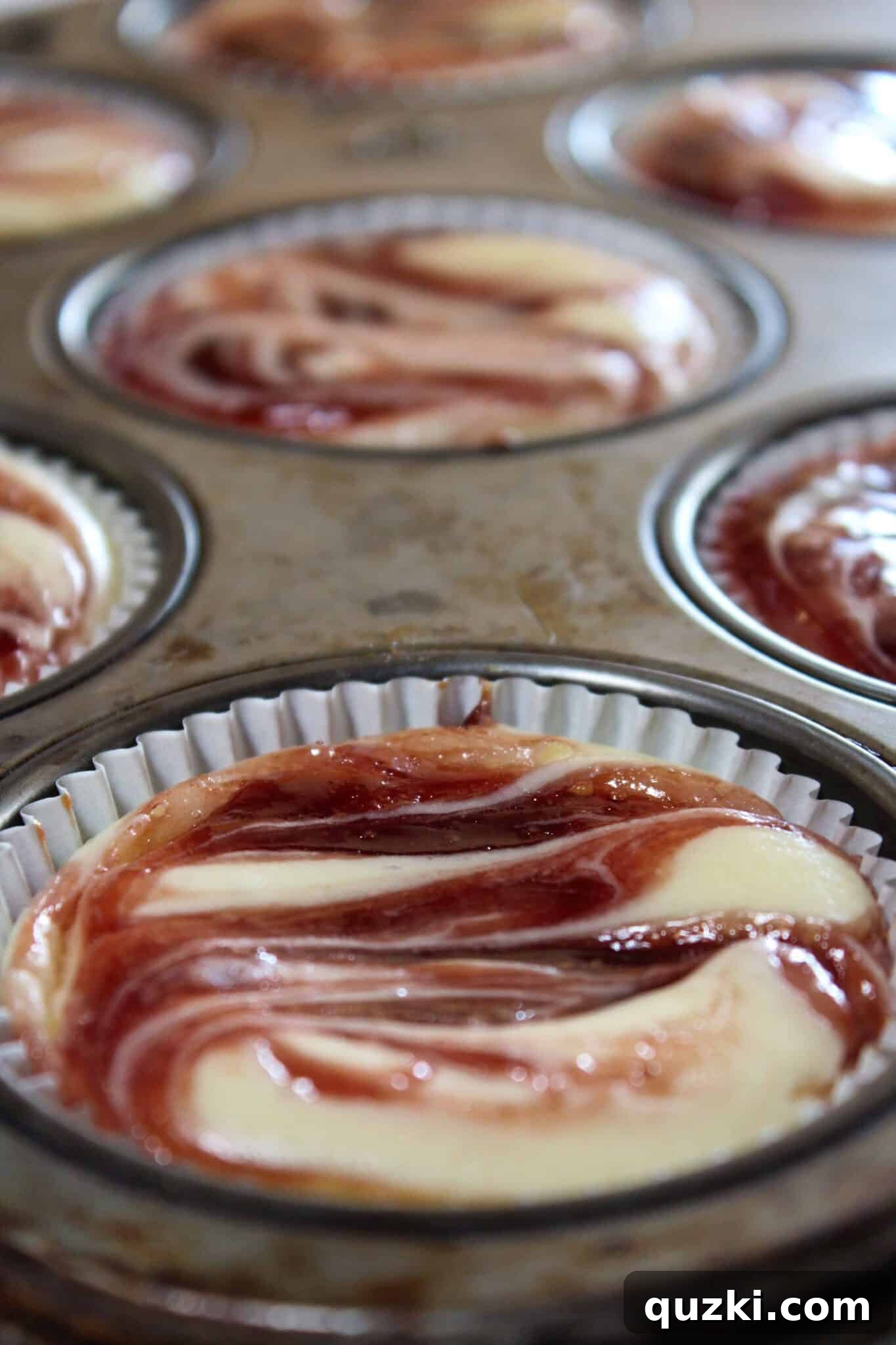 Decadent Mini Raspberry Cheesecake Cups 13 Freshly chilled Mini Raspberry Cheesecakes, ready to be served.