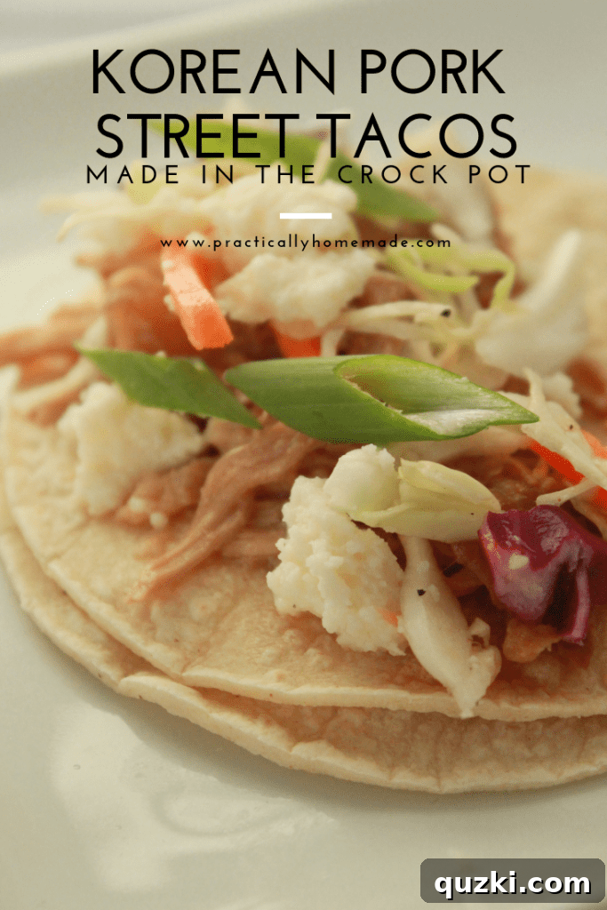 Delicious Korean Pork Street Tacos made in a crock pot, garnished with slaw and queso fresco on corn tortillas, ready to serve.