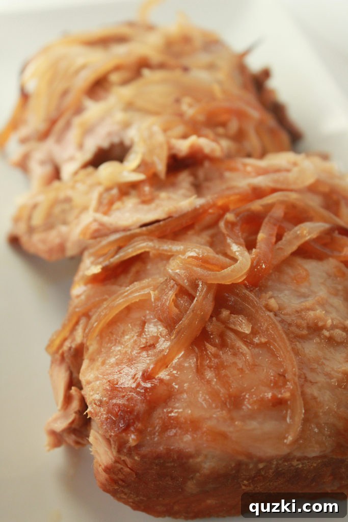 Fully cooked and tender Korean pork roast in the slow cooker, ready to be shredded for tacos.